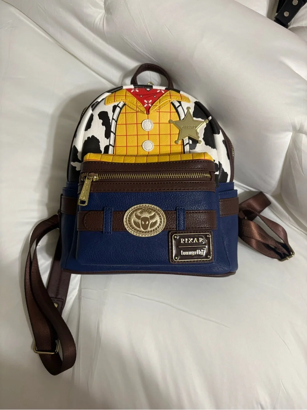 Loungefly Woody-Inspired Mini Backpack in Blue, Yellow, Brown, White, Black